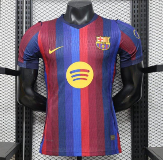 FC Barcelona home soccer jersey with red and blue vertical stripes, featuring a yellow Nike swoosh, FC Barcelona crest, and a yellow Spotify sponsor logo, displayed on a black mannequin torso.